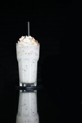 sweet milk shake frappe with topping cream, almond, hazelnut, white milk