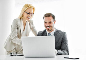 young business people meeting office teamwork group success corporate discussion laptop businessman woman teamwork team businesswoman man corporate communication desk computer presentation 