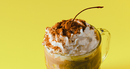 A glass of frappe with cherry