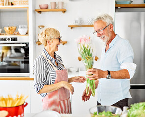 love kitchen senior woman man couple home retirement flower together romance gift present surprise anniversary holiday dating celebration date giving birthday