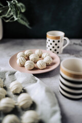 Delicious homemade white chocolate truffles with almonds and nuts in a retro grunge style.