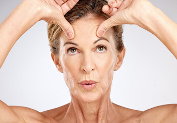 Senior woman, beauty portrait and face lift on gray studio background. Wellness, skincare model and...