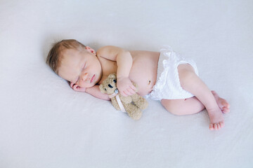 Peaceful sleeping newborn baby two weeks old. - 580106375