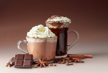 Hot chocolate and coffee with whipped cream sprinkled with chocolate crumbs.