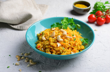 Yellow Turmeric Rice with Vegetables on Bright Background