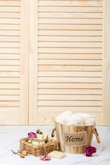 Natural soap with rose flowers. Face care products. Prepare to bath. Spa therapy concept photo. Organic cosmetic on wooden and marble background. Cosmetics for relax and aromatherapy. home hygiene