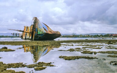Shipwreck on pangandaran beach, indonesia