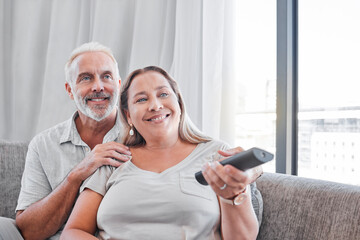 Senior couple, watching tv and relax on sofa in living room together for happy retirement. Love, streaming television and elderly woman with retired man relaxing on couch, smile for comic movie