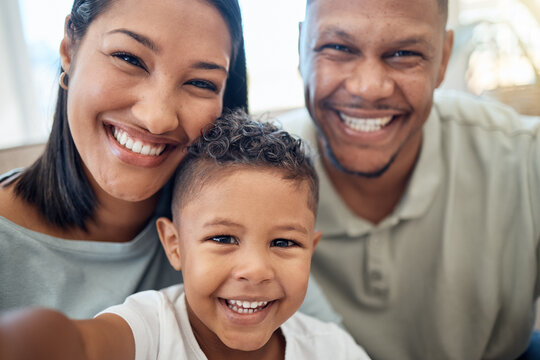 Mother, father and child in a selfie or portrait in the house living room bonding and enjoying holidays as a family. Mama, dad and happy young boy kid or boy with a big smile loves pictures in Mexico