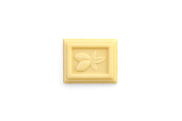 A piece of white chocolate bar on a white background. Top view.