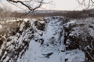 Canyon of Abiskoj&aring;kka River, which flows into Lake Tornetr&auml;sk. Abisko National Park (Abisko nationalpark), Sweden, Arctic Circle, Swedish Lapland. Little silhouettes of people on trail.