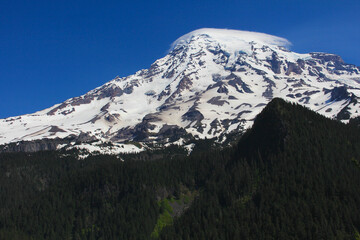 Fototapeta premium Mount Rainier National Park with blue sky and small cloud