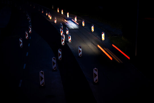 Cars On A Road With Roadworks. Works On The Road. Night Traffic.