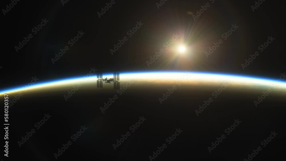 Wall mural international space station iss floating in orbit above planet earth in outer space. sunrise or suns