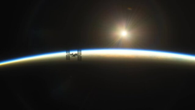 International Space Station ISS Floating in Orbit above Planet Earth in outer space. Sunrise or sunset view from space