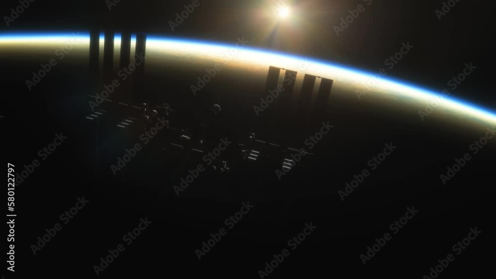 Wall mural international space station iss floating in orbit above planet earth in outer space. sunrise or suns