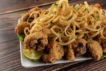 Appetizer - portion of chicken with onion rings