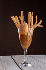 Dessert - Cup with dulce de leche and mini churros - obrazy, fototapety, plakaty
