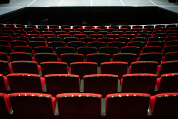 empty theater with red chairs