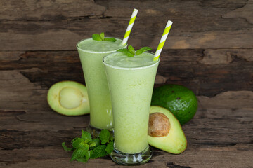 Avocado fresh cocktail smoothies fruit juice beverage healthy the taste yummy in glass drink episode good morning on wooden background.
