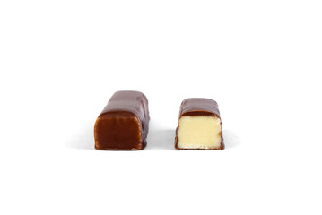 Chocolate candy with milk praline filling on a white background.