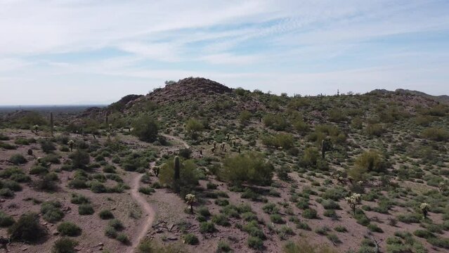 Aerial push back along a desert hiking path