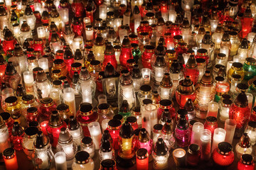 Decorative votive candles during All Saints Day at the cemetery.