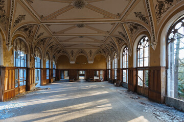 Large hall of abandoned building in gothic style
