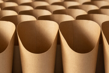 Cardboard takeaway cartons containers in rows, with no branding. Sustainable biodegradable plastic...