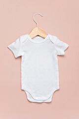 Mockup of white infant bodysuit made of organic cotton. Onesie template for brand, logo,...