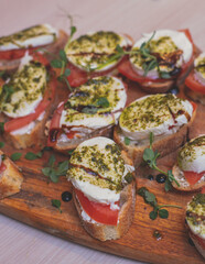 Office party catering, table with variety of different food snacks on a workplace, sandwiches, croissants and appetizers on a party event or celebration, coffee break for colleagues and employees
