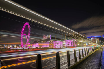 View of the London Eye from the Westminster Bridge during night - obrazy, fototapety, plakaty