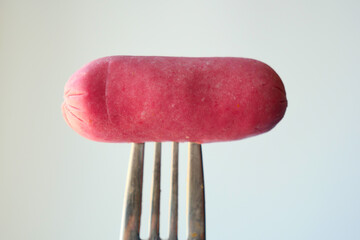 close up of Mini Sausage against white background 