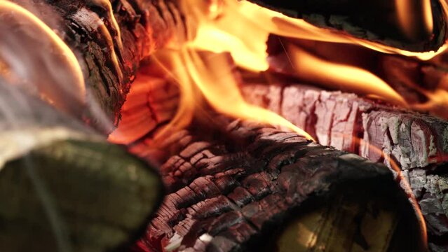 Grill section is on fire. Big fire made for BBQ coals and grilling at summer weekend. Big camp fire close up.