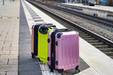 suitcase on railway infrastructure transit woman female road back walk wait time move commuter...