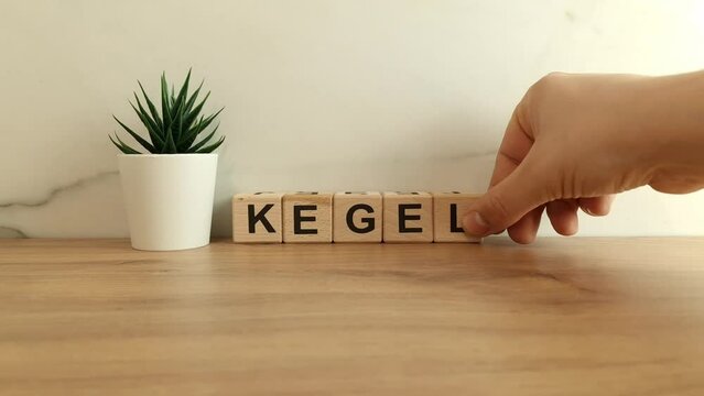 Word kegel from wooden blocks on desk