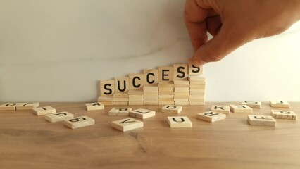 Word success from wooden blocks. Business growth process, challenge, achievement concept