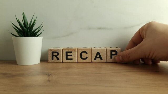 Recap word from wooden blocks. Business concept