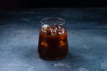 Cold iced dark coffee in a glass.