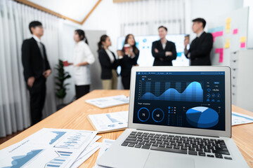 Focus laptop monitor display dashboard report by business intelligence, analyzed financial data for...