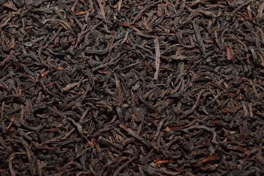 black tea background. dried black tea. English Breakfast Tea ingredients. Ceylon Black Tea close up. top view.