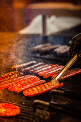 Fototapeta premium barbecue grilled meat and sausages fire and smoke