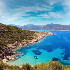 Fototapeta na wymiar Summer sea scenery with aquamarine transparent water. View from shore (Sithonia, Halkidiki, Greece).
