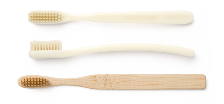 three toothbrushes isolated over a transparent background, lifestyle or personal care design elements, flat lay / top view