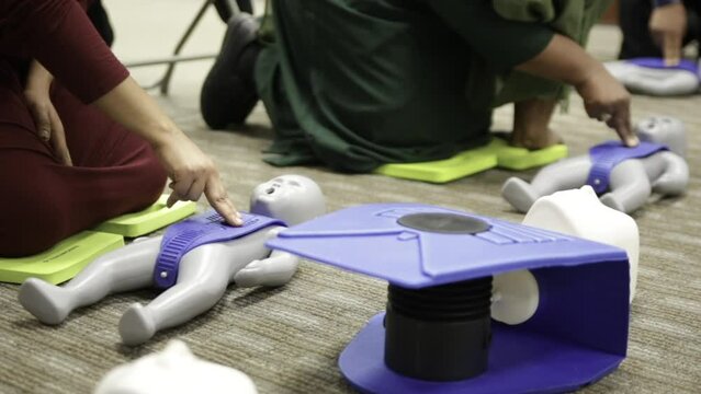 Muslim trainees taking cpr class and first aid