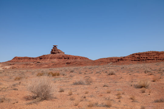 Mexican Hat climbers, Utah, eroded layered sandstone wind  water