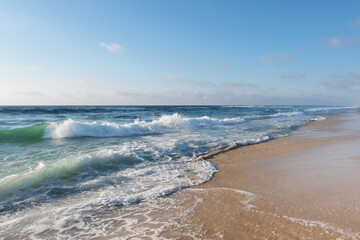 Beautiful View on high waves on the empty coast of the Atlantic Ocean. Deserted beautiful ocean beach.