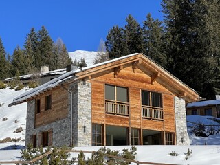 Swiss alpine holiday homes, mountain villas and holiday apartments in the winter ambience of the tourist resorts of Valbella and Lenzerheide in the Swiss Alps - Canton of Grisons, Switzerland (Schweiz