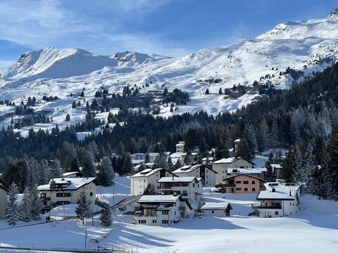 Swiss alpine holiday homes, mountain villas and holiday apartments in the winter ambience of the tourist resorts of Valbella and Lenzerheide in the Swiss Alps - Canton of Grisons, Switzerland (Schweiz