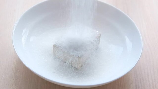 pour sugar slowly over fresh yeast in a white plate add dry ingredients to flour in steel bowl